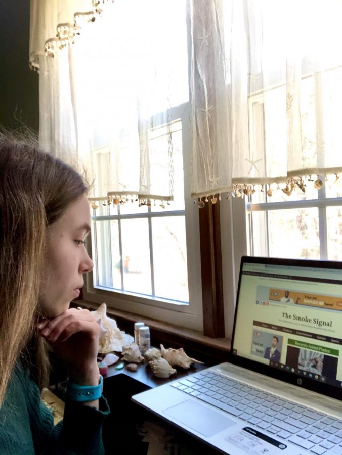 Quinn Suomala checks out the online newspaper.