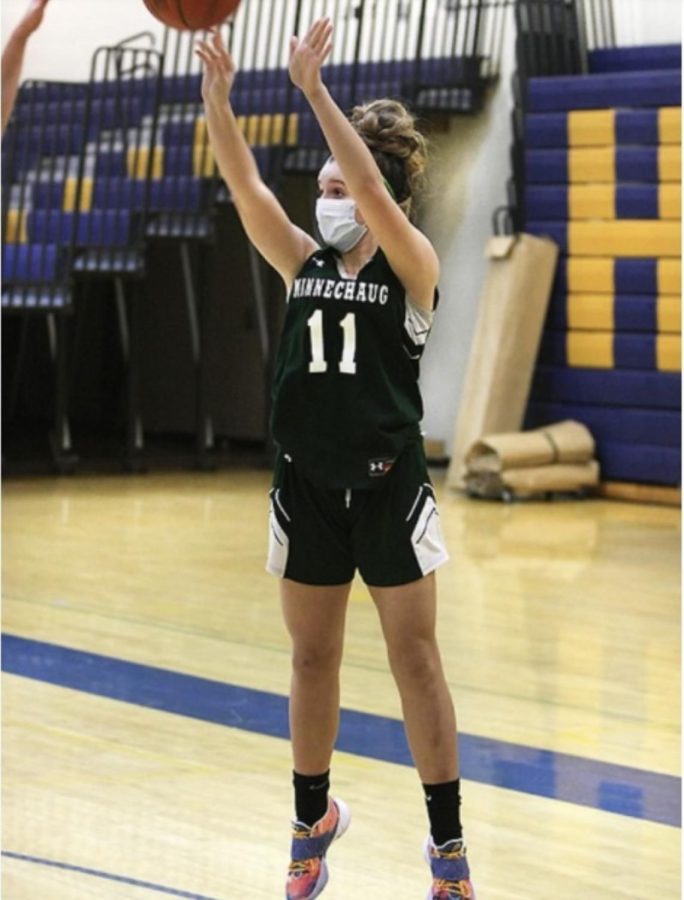 Jayla Comes sinks a jumpshot. She has been competing on the varsity level since her fresmen year.